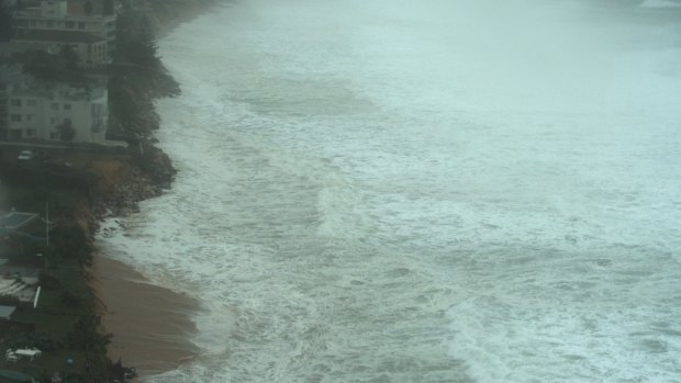 Houses under threat at Narrabeen on Sunday. 