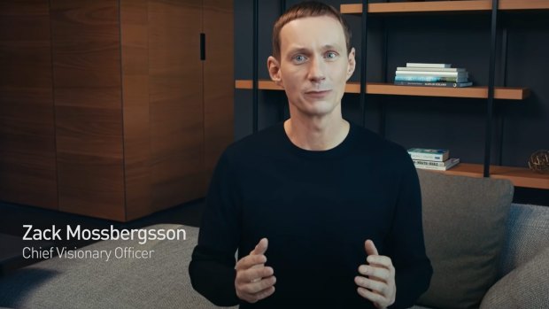 The video begins by introducing a "Chief Visionary Officer" named Zack Mossbergsson who sports Zuckerberg's Augustus Caesar haircut and black crew-neck sweater. 