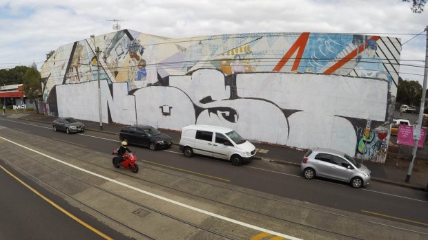 The historic Northcote mural after being tagged by Nost.