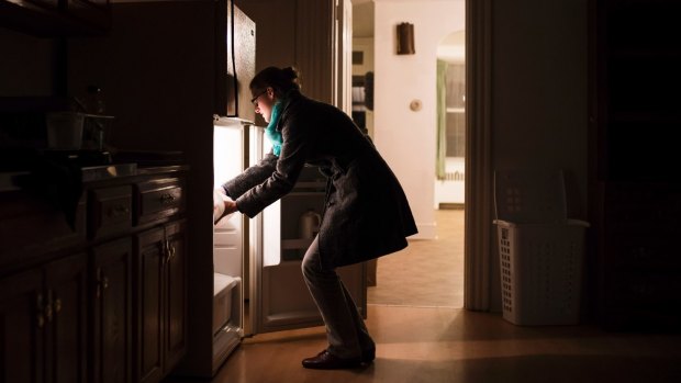 Gaby Garver, a case worker with the Church World Service, leaves a home-cooked meal in a house prepared for the arrival of a Syrian refugee family.