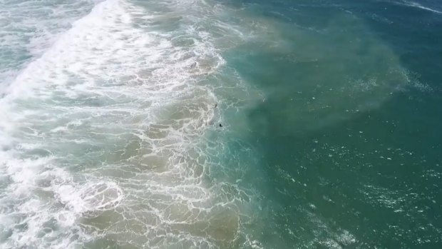 The two swimmers were seen struggling in heavy surf at Lennox Head. 