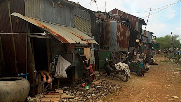 The Cambodian village of Khmounh is effectively a squatter settlement. Some of the women work in garment factories earning $US128 per month for a six-day working week. 