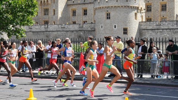 Ethiopia's Aselefech Mergia, Portugal's Catarina Ribeiro and Australia's Jessica Trengove (from right) lead the pack of the women's marathon as they pass by the Tower of London.