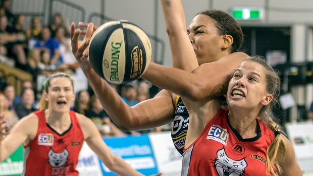 Liz Cambage, of the Boomers, picks up her third foul against the Lynx's Olivia Thompson.