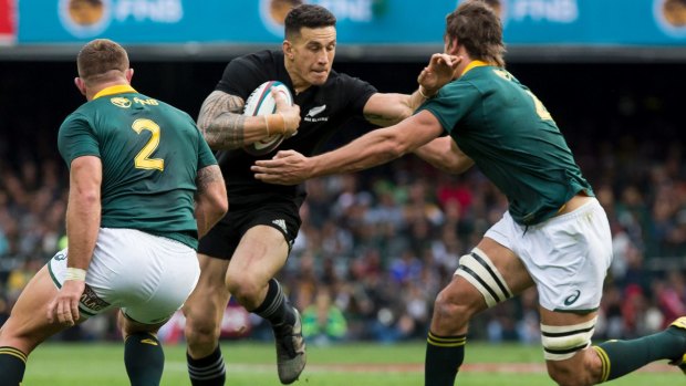 New Zealand centre Sonny Bill Williams fends of South African defenders.