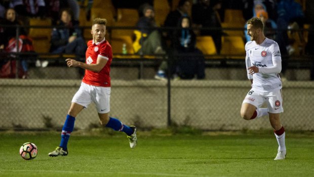 Canberra FC's Thomas James sets up a cross against the Wanderers on Wednesday night.