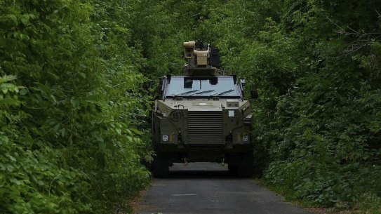 HOLD FOR WEDNESDAY 22ND JUNE/ DAN ADAMS APPROVAL
A Bushmaster used by a mechanised infantry unit drives along a road in a secret position in the Donbas, heading towards the frontlines in the past week. Donbas, Ukraine. June, 2022. Photo: Kate Geraghty
Note: at the request of Ukrainian armed forces identifying markings at the rear &amp; side of the bushmaster is pixelated.