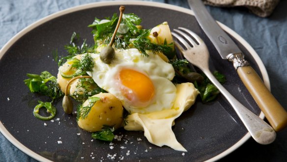 Vinaigrette potatoes with cornichons, caperberries, dill, creme fraiche and fried egg.