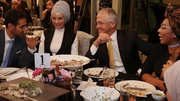 Waleed Aly (left) with his wife, Susan Carland (second left) attend Prime Minister Malcolm Turnbull's 2016 Iftar dinner.