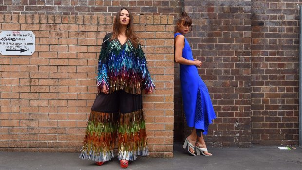 Cristina Garces wears a top and trousers by Romance Was Born, while Nikki Crerar sports a Dion Lee dress. Both designers are finalists for the Australian Fashion Laureate. 