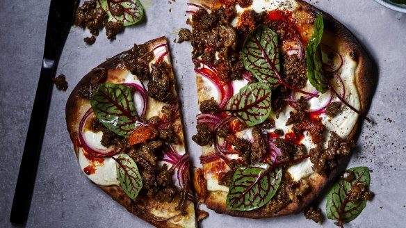 Spicy lamb naan pizza and Indian pickle.  