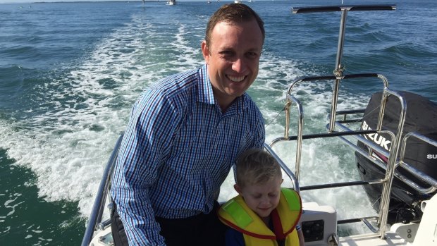 Environment Minister Dr Steven Miles with his son Aidan on Moreton Bay.