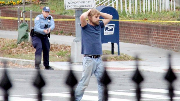 Edgar Maddison Welch surrenders to police.