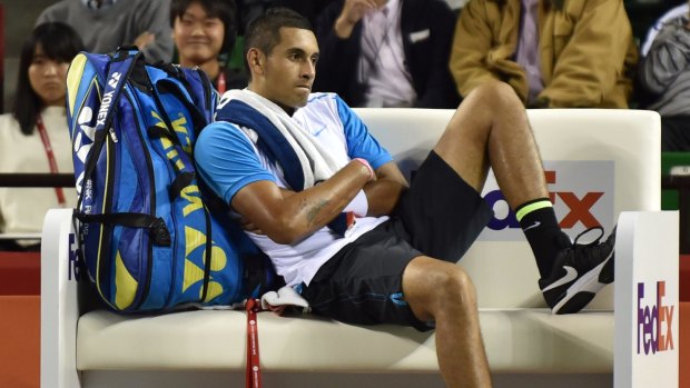Nick Kyrgios takes a breather during his match in Japan last week.