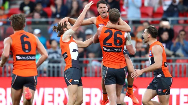 Emphatic: Josh Kelly of the Giants celebrates kicking a major in the final quarter.