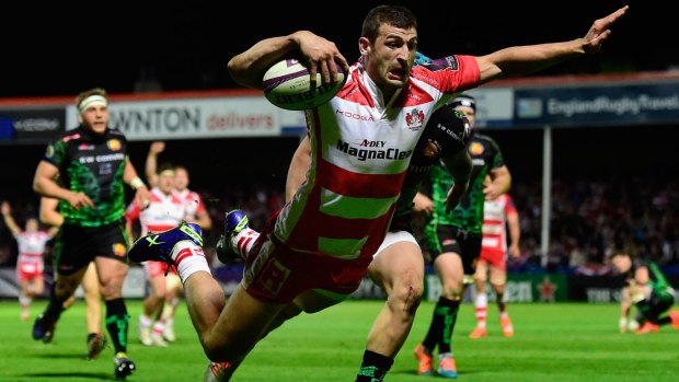 Jonny May of Gloucester dives over for the final try.