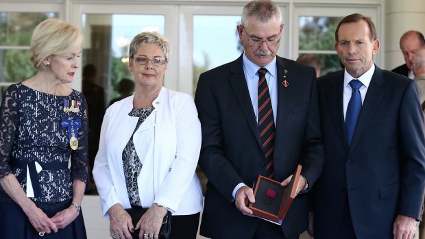 Doug and Kaye Baird are presented with a Victoria Cross for their late son Corporal Cameron Baird VC MG by Governor-General Quentin Bryce with Prime Minister Tony Abbott in February.