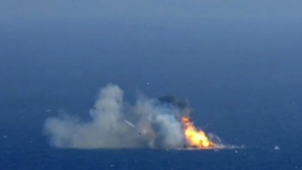 The SpaceX rocket crashing on April 14 after failing to land on an ocean platform.