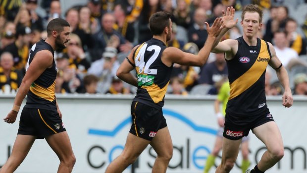 High five: Fans will see plenty of  the Tigers at the MCG.