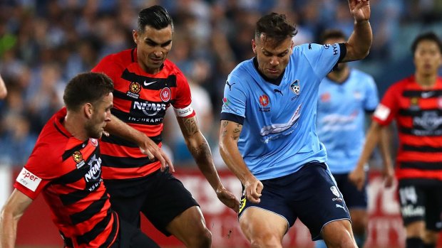 Marked man: Sydney FC marquee Bobo is challenged by Robbie Cornthwaite.