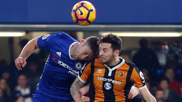 Hull City's Ryan Mason, right, was injured during this clash of heads with Chelsea's Gary Cahill.