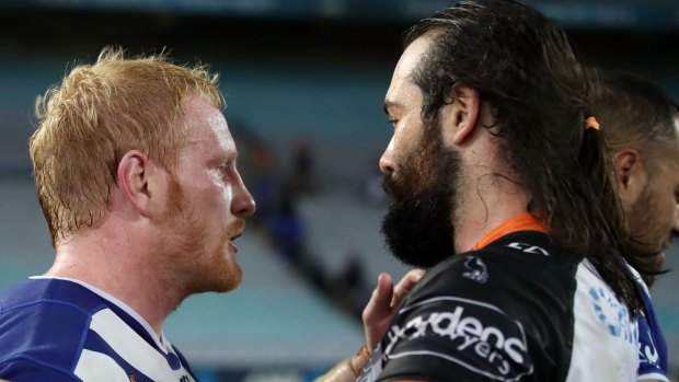 Trading places? James Graham of the Bulldogs with Aaron Woods.