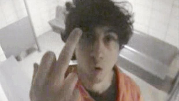 Is this the real Dzhokhar Tsarnaev? The convicted bomber extends his middle finger to a security camera in his jail cell. 