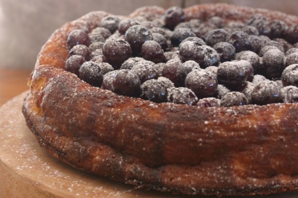 Orange and almond cake topped with blueberry compote.