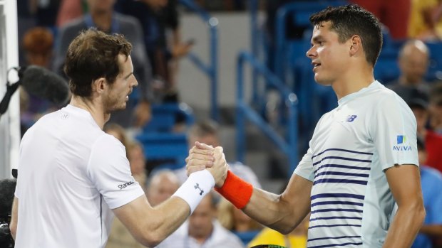 Commanding win: Andy Murray and Milos Raonic shake hands after the match.