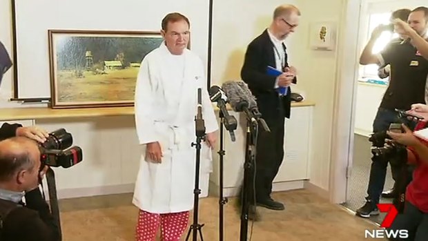 Paul Pisasale, wearing a hospital gown and pyjamas, the day he announced his resignation as mayor.