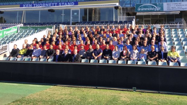 164 people gather at Parramatta stadium with officials to represent the number of people who have died on NSW roads this year.