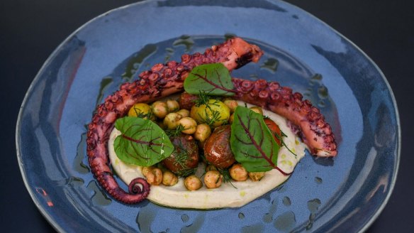 Octopus with eggplant puree, tomatoes and chickpeas.