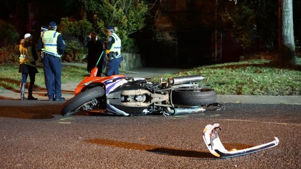 A 43-year-old Pearce man has died after a car and motorbike collided in Red Hill on Saturday night.