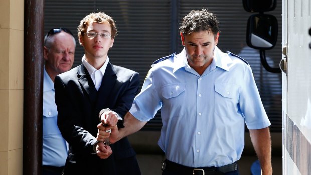 Daniel Jack Kelsall is led into a prison truck after being found guilty of murdering Morgan Huxley.