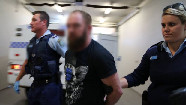 NSW Police arrest a man in Nelson Bay on Monday.
