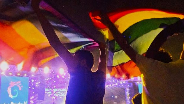 Anti-gay crackdown: Two people hold up a rainbow flag at a concert in Cairo, Egypt.