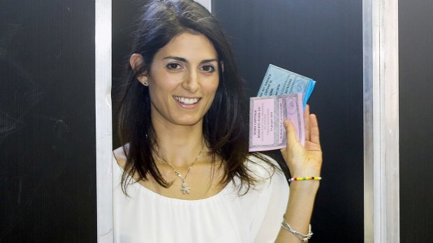 Virginia Raggi casts her ballot in Rome.