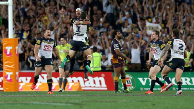 The Cowboys celebrate winning the 2015 NRL grand final. 