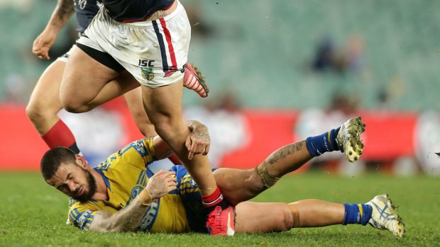 Down and out:  Nathan Peats of the Eels suffered a broken neck in the match against the Sydney Roosters  at Allianz Stadium on Saturday night. 