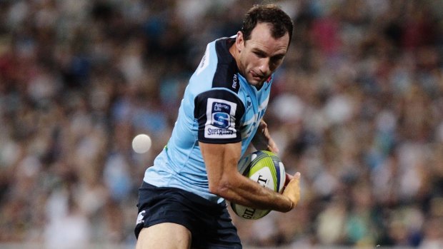 Busy boy: Matt Carraro is tackled during the round two NRL match between the Brumbies and the Waratahs at GIO Stadium.