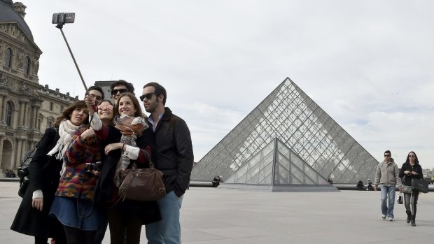 Selfie sticks may soon be banned inside the Louvre, the world's most visited museum.