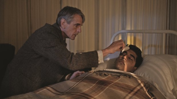Jeremy Irons (left) tends to Dev Patel in <i>The Man Who Knew Infinity</i>.