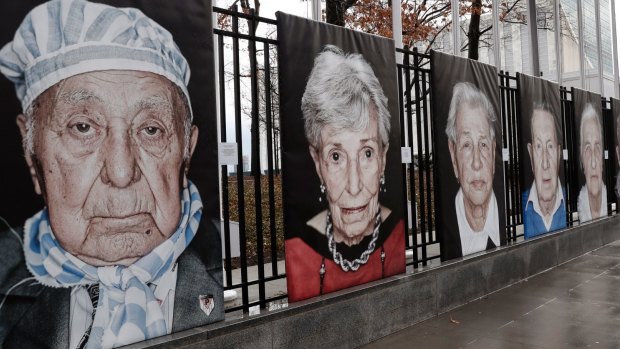 Portraits by Italian photographer Luigi Toscano form a Holocaust remembrance exhibition outside the United Nations headquarters in New York.