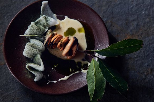 Grilled blue mussels on a bay leaf spear.