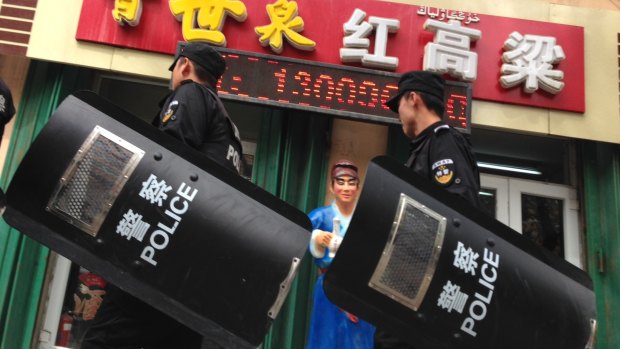 Chinese police patrol the streets of Urumqi in Xinjiang in May of this year. Despite an increased military and police presence, unrest in the far-western region of China continues.