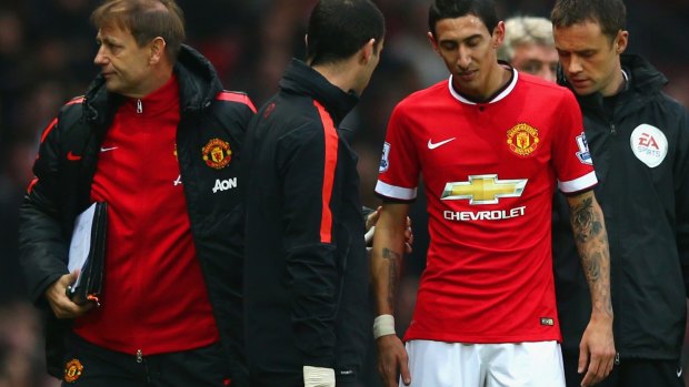 Turning point:  Angel Di Maria hobbles off against Hull.