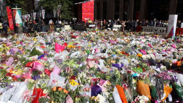 Tribute: The memorial to the victims of the Lindt cafe siege continued to grow in Martin Place on Wednesday.