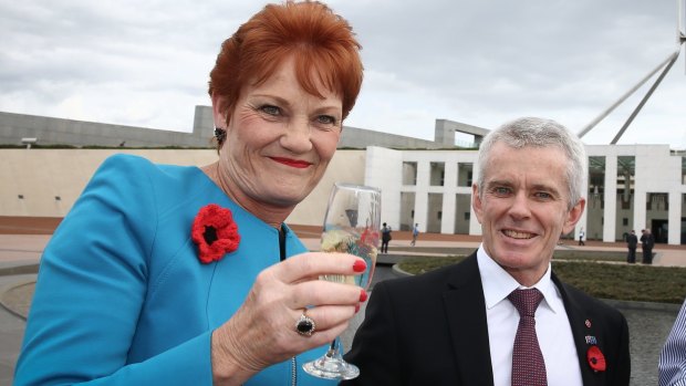 Senator Pauline Hanson with Senator Malcolm Roberts at Parliament House.