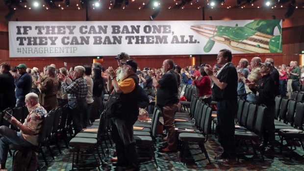 National Rifle Association members applaud during their annual meeting, held in Nashville in April.