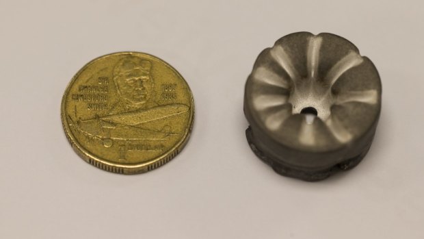 One of the 2.5 centimetre diameter magnesium cathodes (right) from Dr Neumann's ion drive after use.